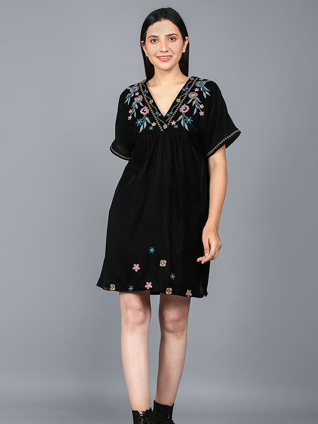 Multi-coloured flower motifs adorn the V-neckline of this chic short dress