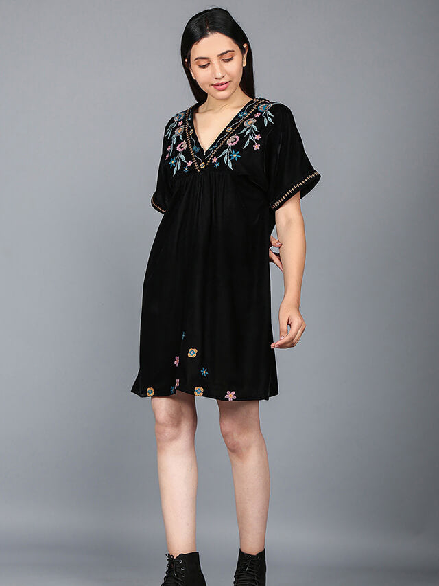 Multi-coloured flower motifs adorn the V-neckline of this chic short dress