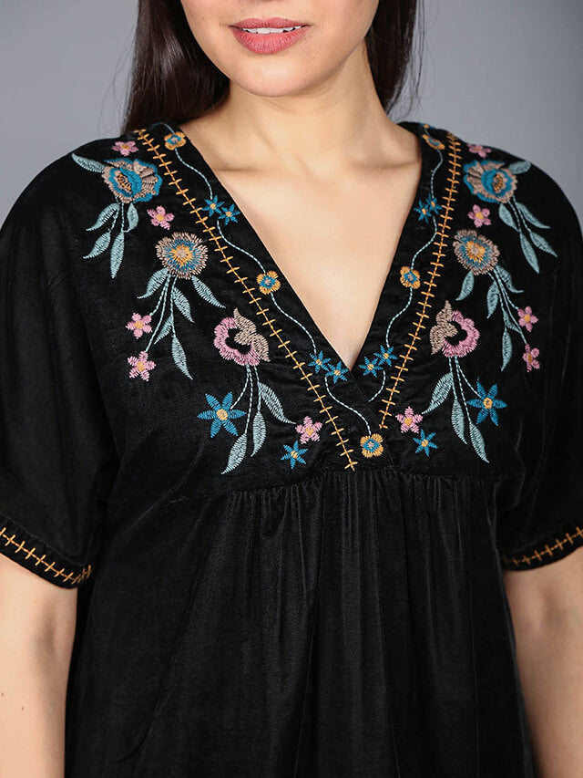 Multi-coloured flower motifs adorn the V-neckline of this chic short dress